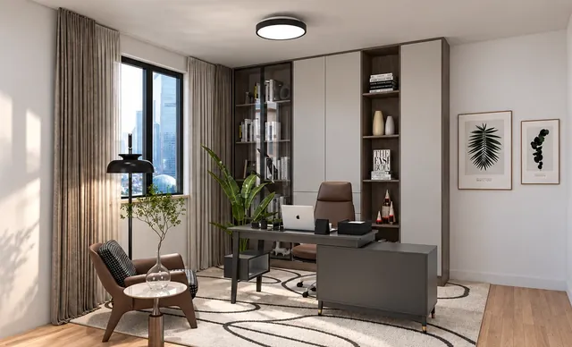 Arbeitszimmer mit Schreibtisch in Anthrazit, Lederstuhl, Holzregalen und gemustertem Teppich